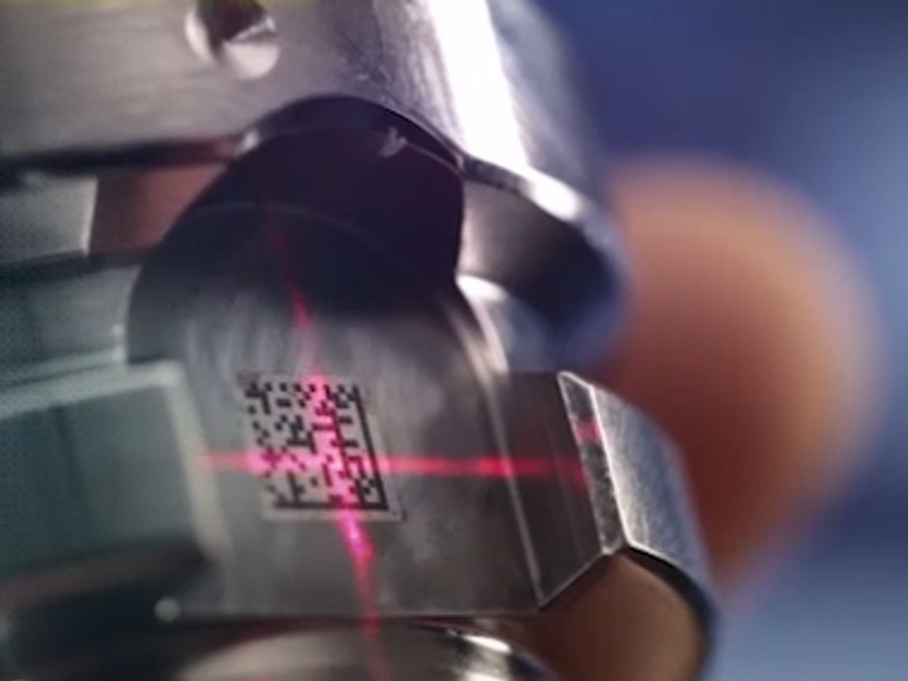 A QR code lasered into a metal tool is scanned