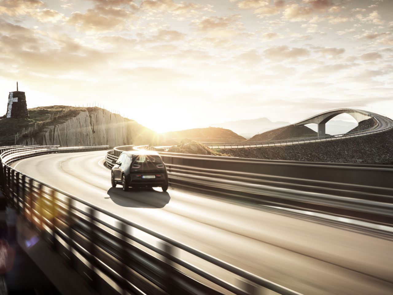 [Translate to Englisch:] Eco-friendly electric car on the road